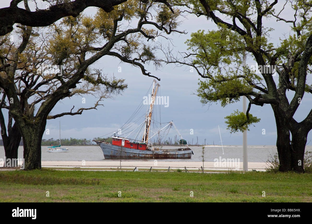Biloxi Mississippi A fishing boat anchored on the Gulf of Mexico beach Stock Photo