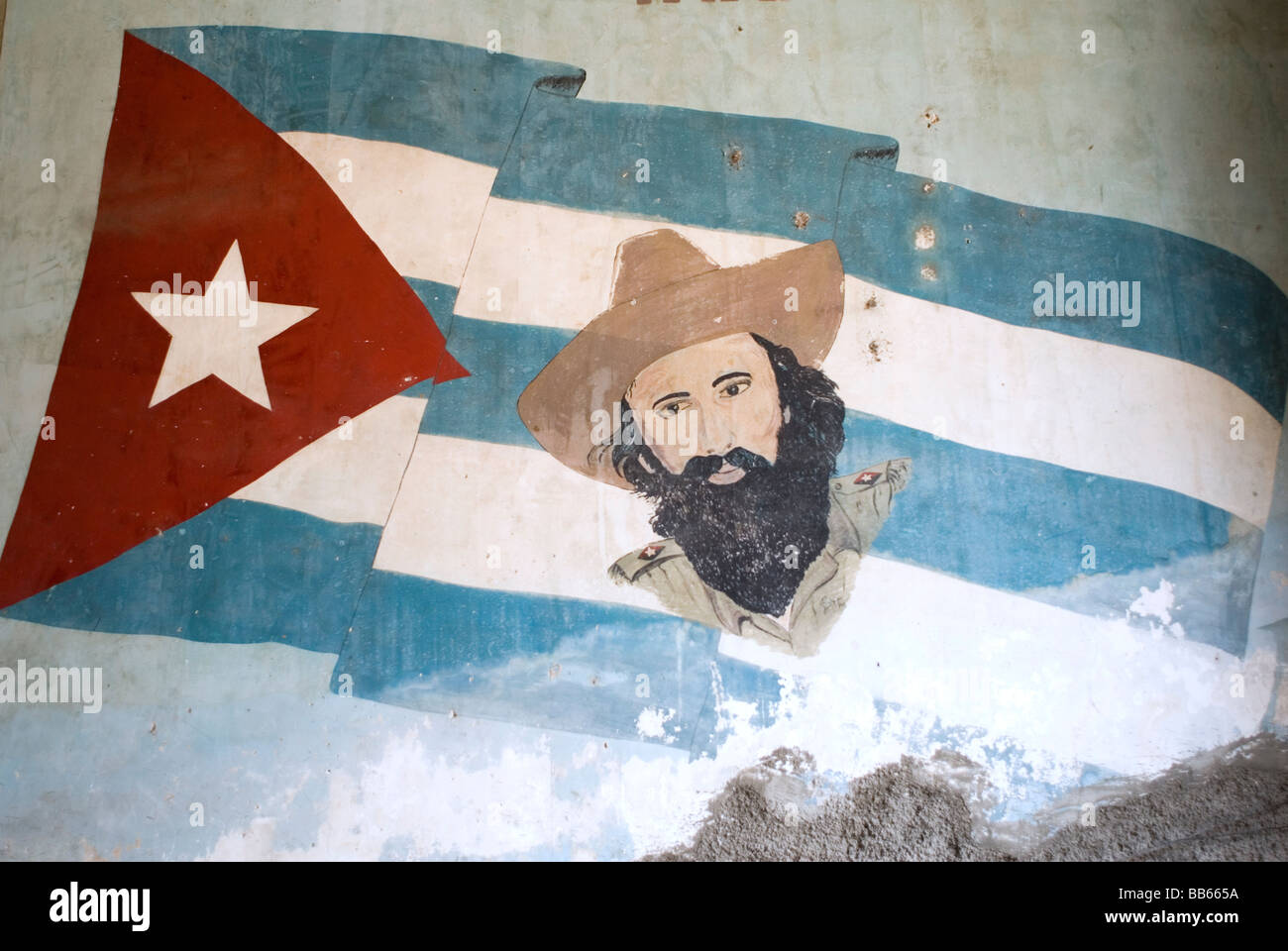 Mural of Camilo Cienfuegos at the entrance of Paladar La Guarida restaurant in Havana Cuba. © Craig M. Eisenberg Stock Photo