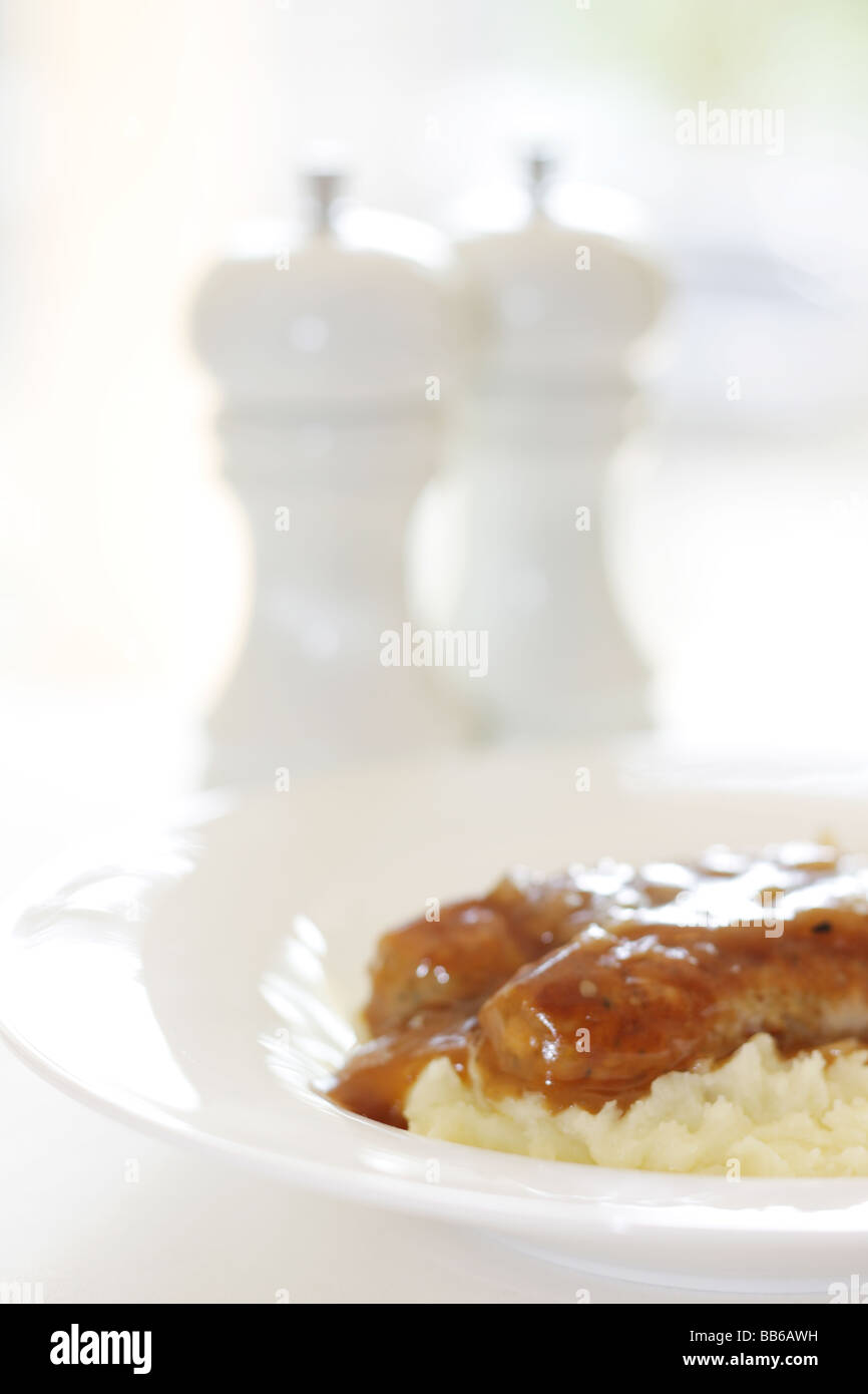 Fresh Pork Sausages With Mash Potatoes Served On A White Plate With No People Stock Photo