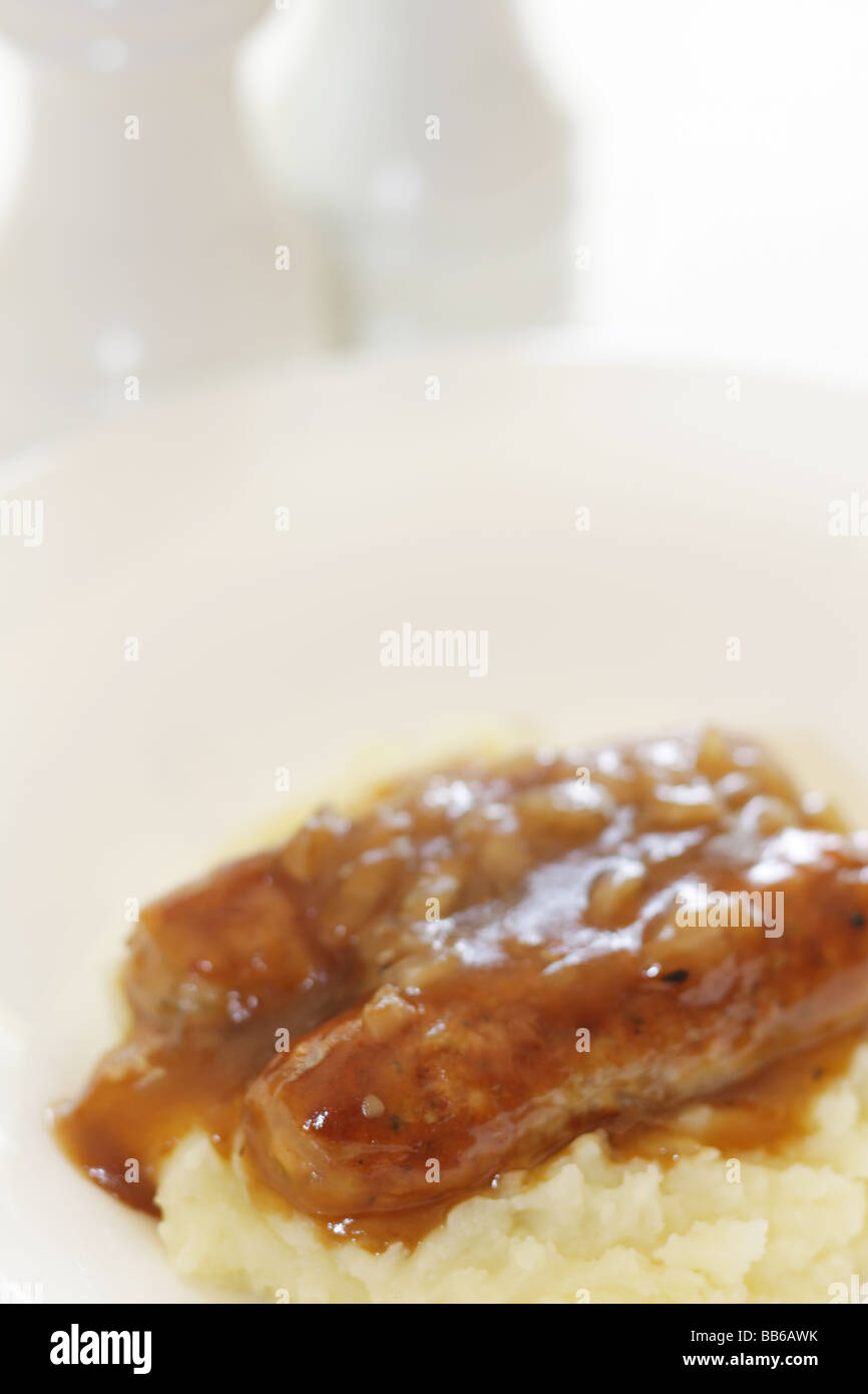 Fresh Pork Sausages With Mash Potatoes Served On A White Plate With No People Stock Photo