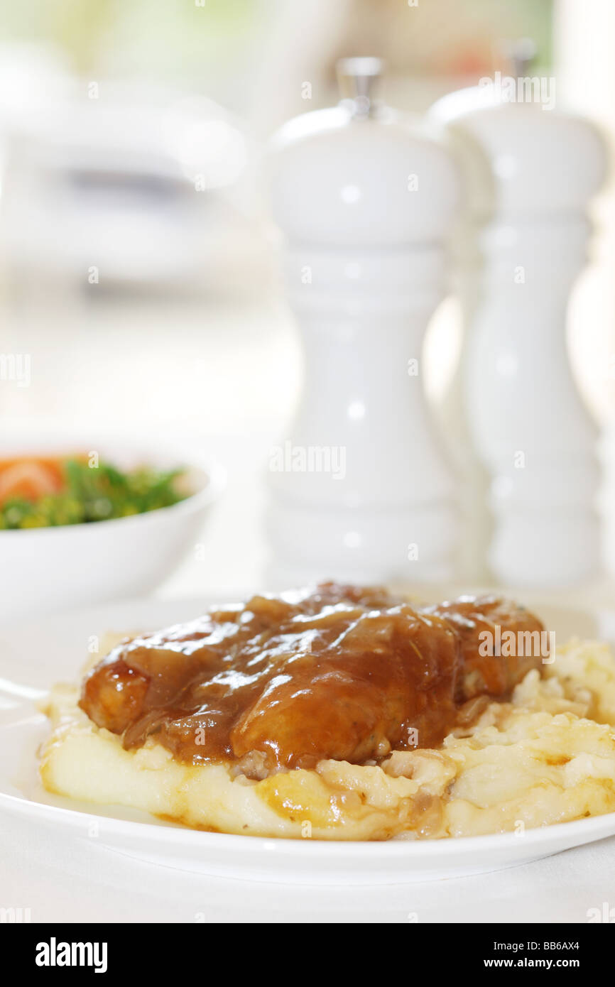 Fresh Pork Sausages With Mash Potatoes Served On A White Plate With No People Stock Photo