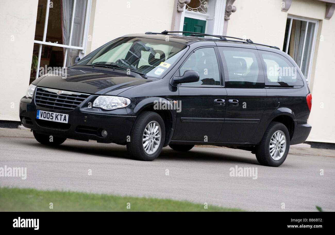 Black Chrysler Grand Voyager LX minivan Stock Photo