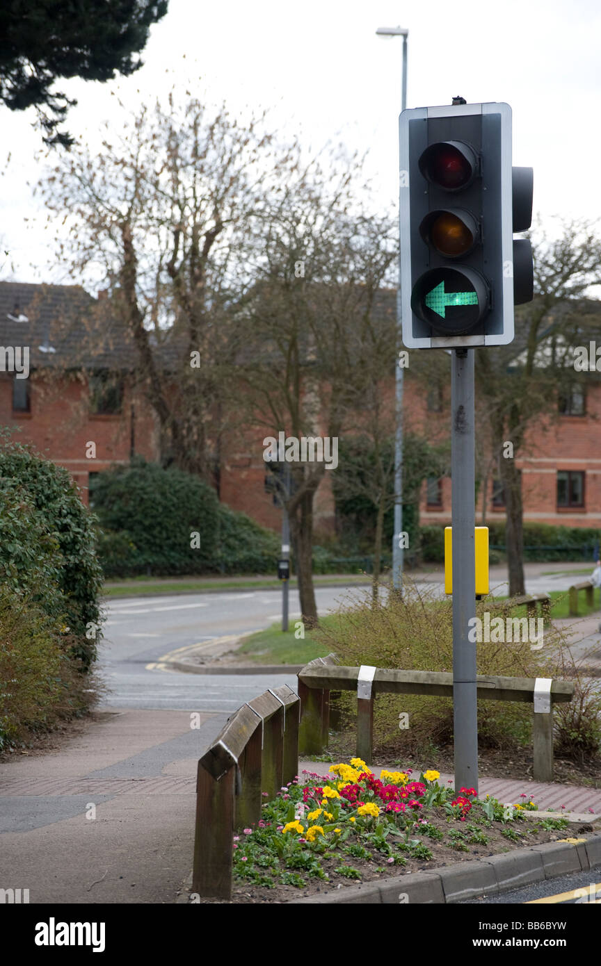 Green traffic light with an arrow showing a traffic filter in a town in  England Stock Photo - Alamy