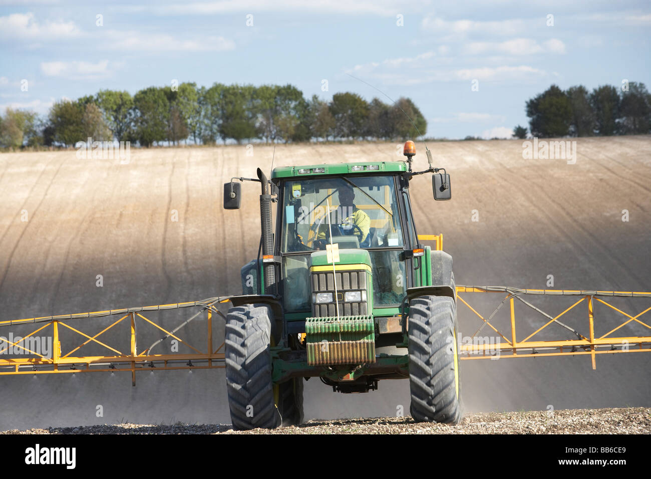 Tractor Spraying Field Stock Photo