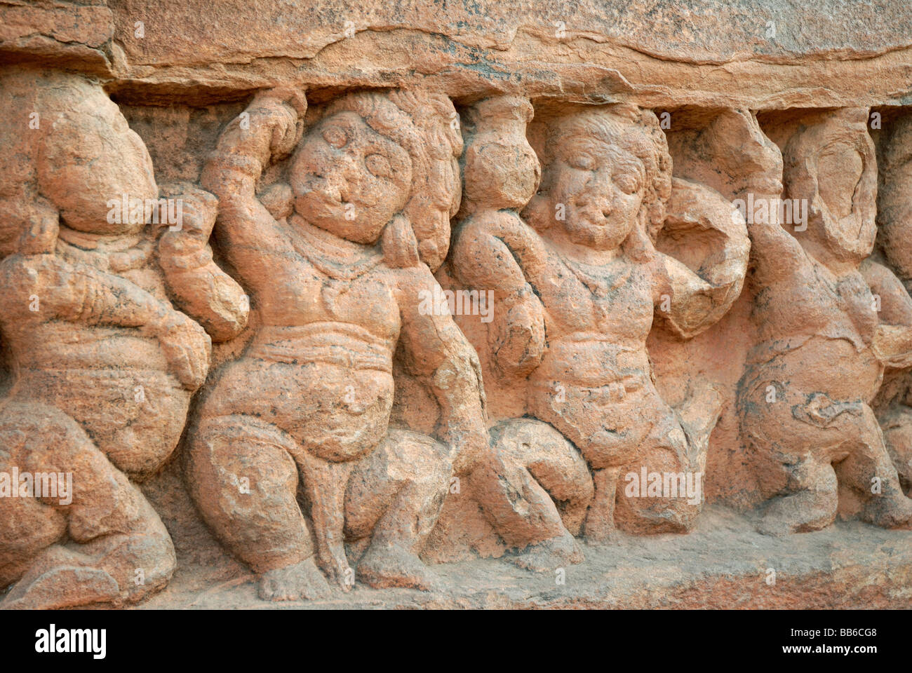 Cave 2 : Dancing gana figures on the outer left wall. Badami , Karnataka, India Stock Photo