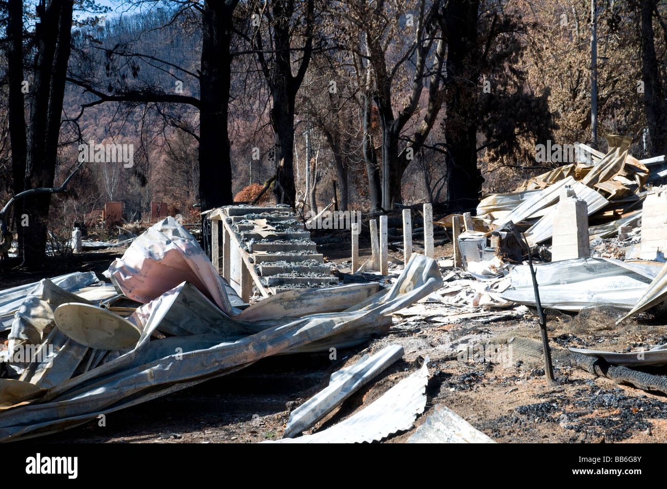 The remains of a home and devastation left after a bushfire Stock Photo