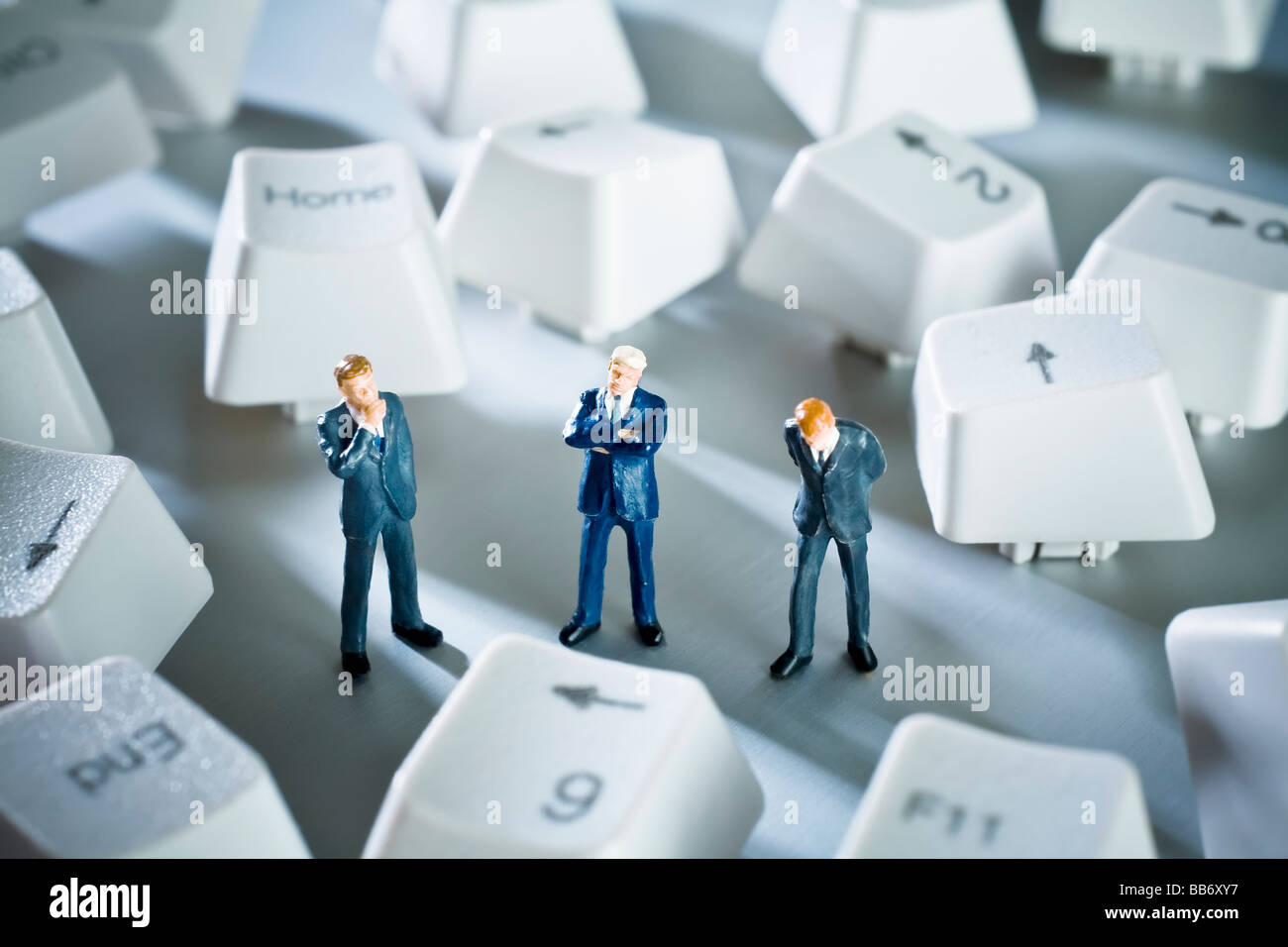 Small business figurines with computer keys Stock Photo