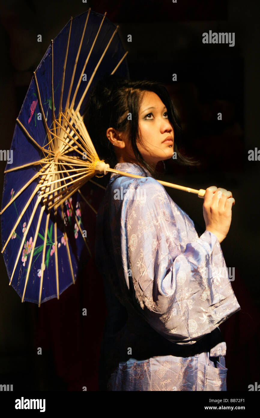 Filipino Girl in a Kimono with an Umbrella Sunshade Stock Photo