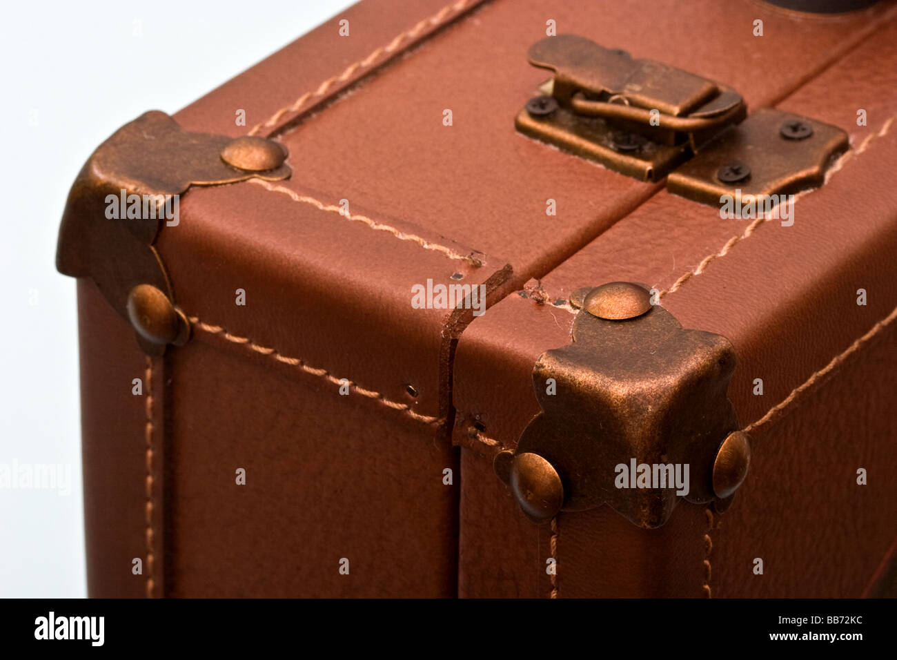 Top corner and old fashioned clasp on a brown leather briefcase Stock Photo