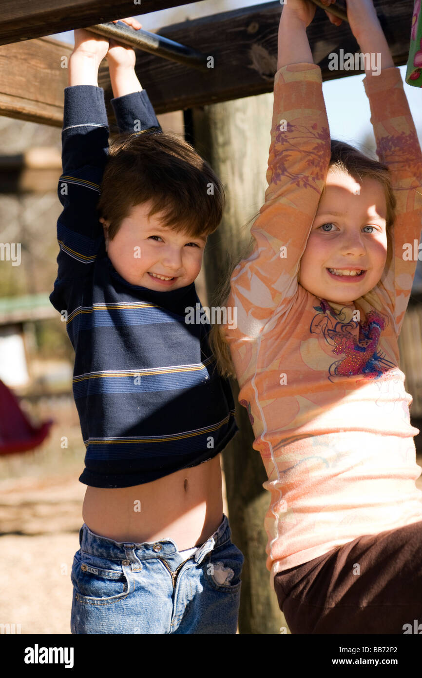 Kids hanging on monkey bars at playground Franklin Park Brevard