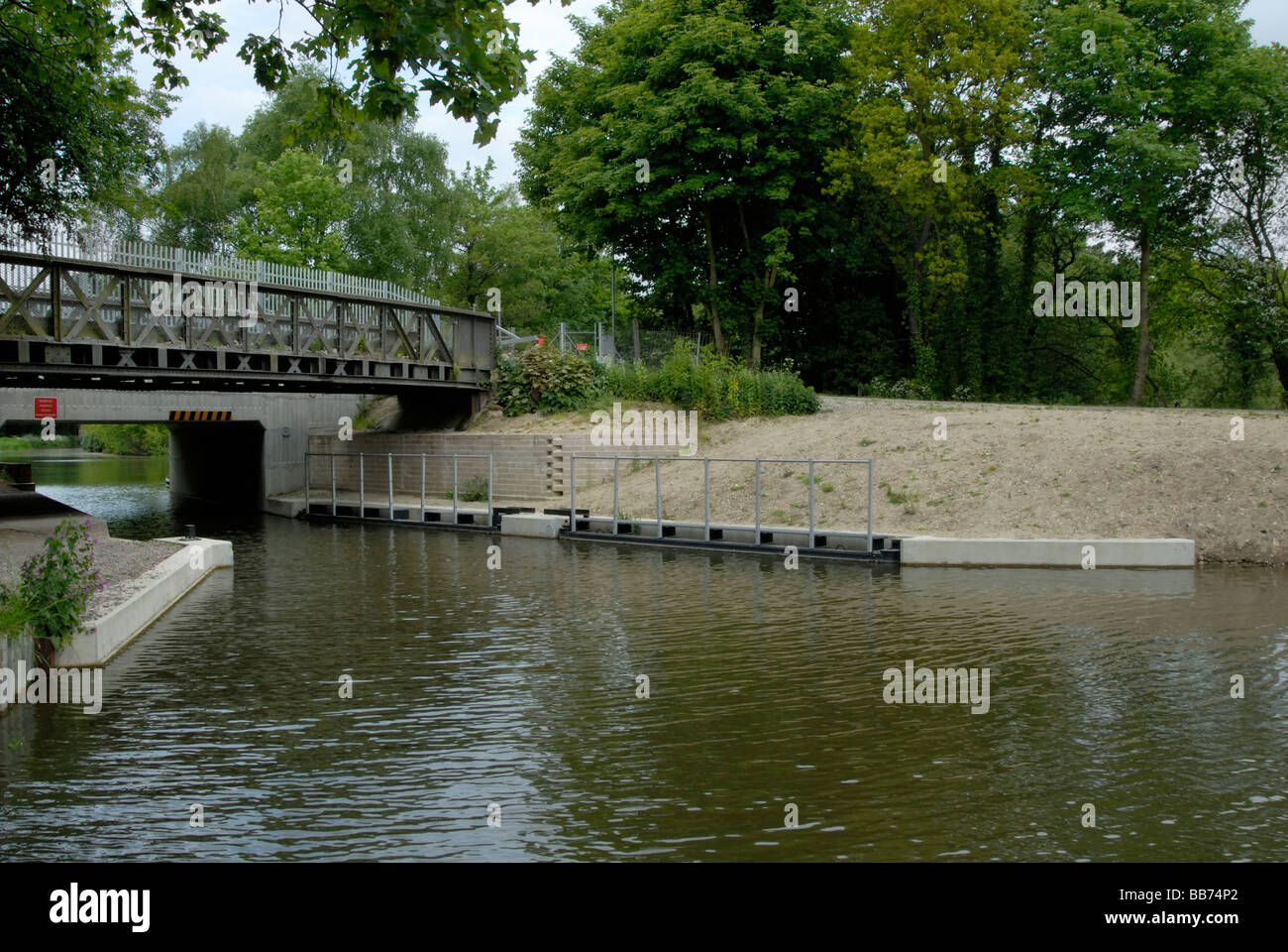Two flap gates used for flood control and water retention, Basingstoke Canal, Ash Vale, Surrey, England Stock Photo