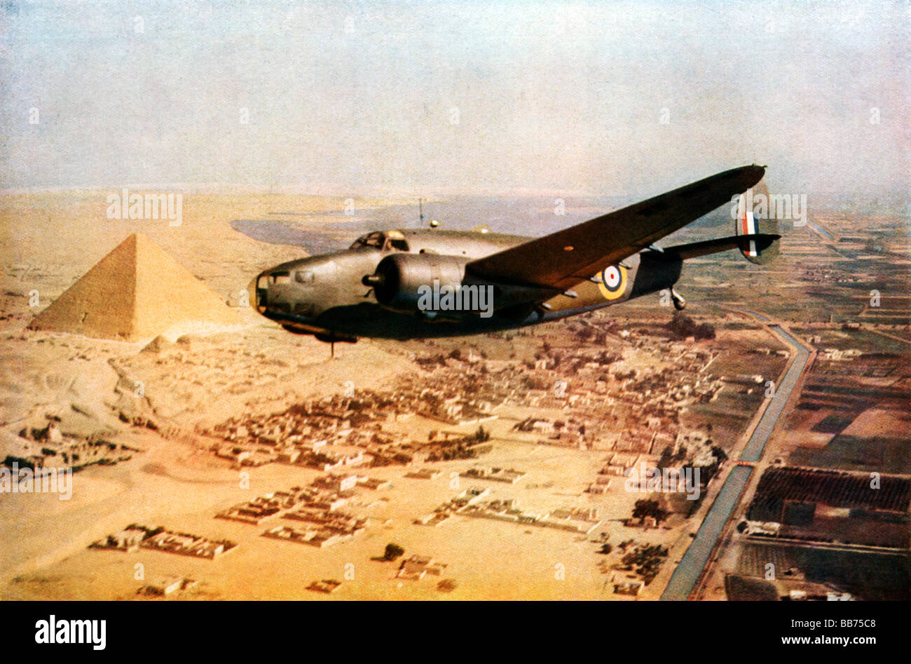 Lockheed Hudson over the Pyramids 1942 colour photo of the RAF reconnaissance bomber flying over Egypt Stock Photo