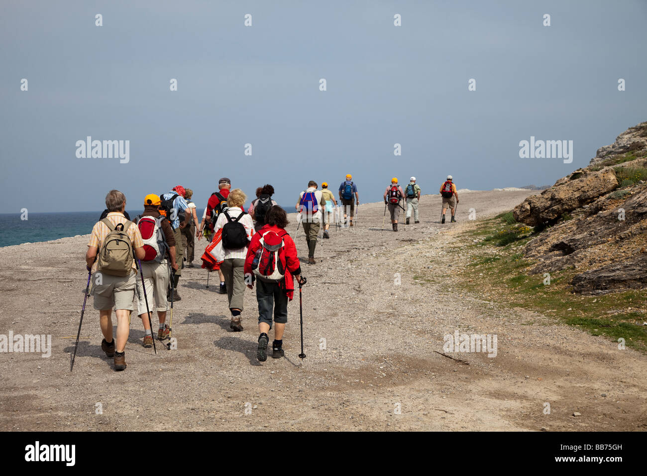 Walking group on coastal track Estrata Mallorca Spain Stock Photo