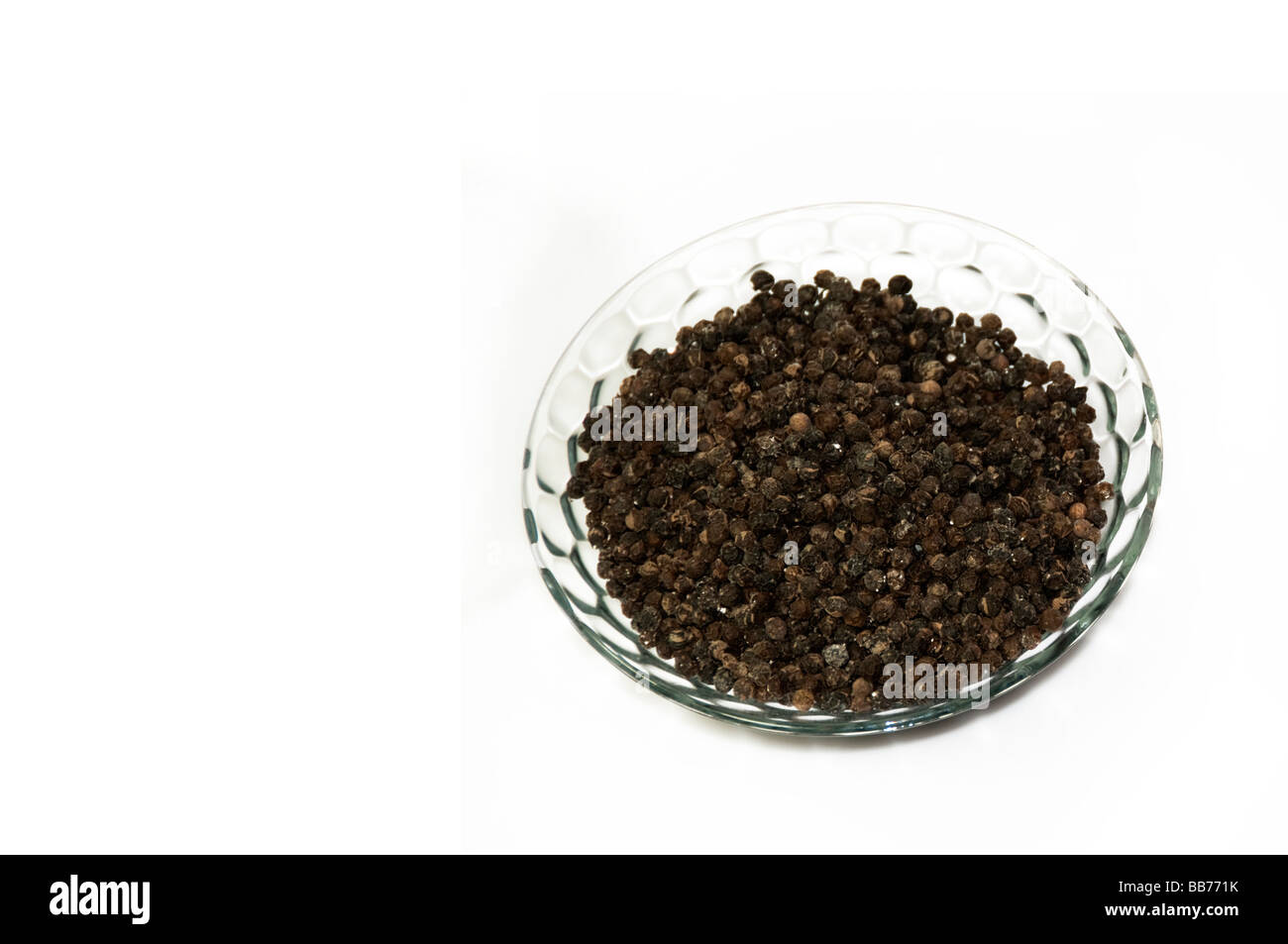 Black pepper spice in glass bowl Stock Photo