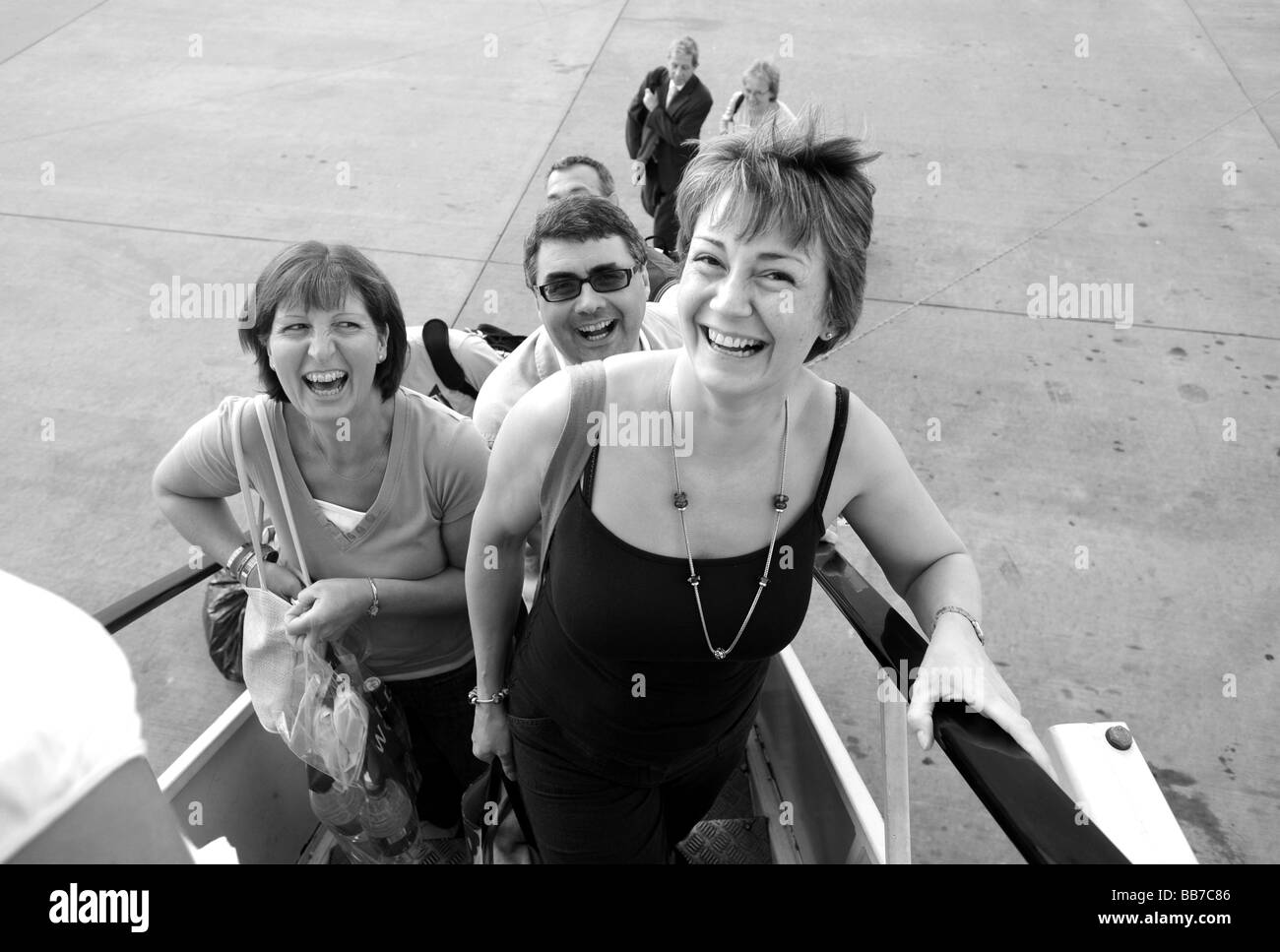 Holiday makers boarding airplane at Stanstead Airport Stock Photo