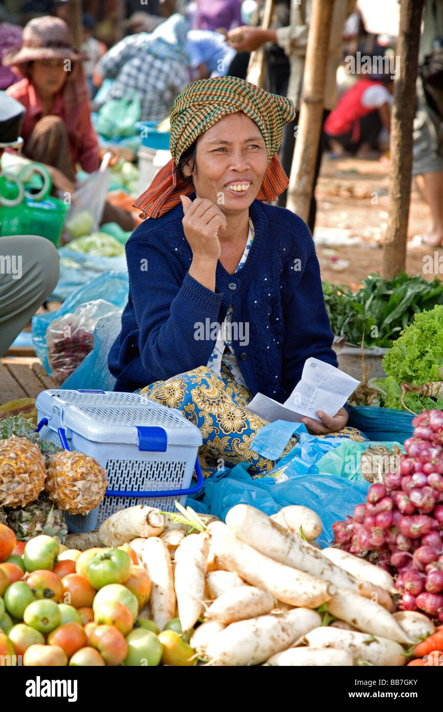 Selling food and souvenirs at the Damnoen Saduak floating market located about 62 miles outside of Bangkok Thailand Stock Photo