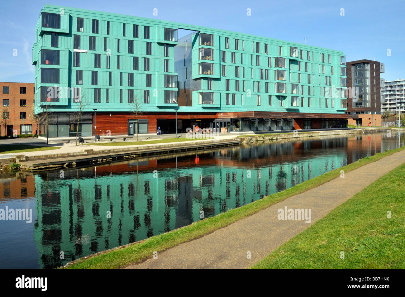 The Regents canal Mile End towpaths with Queen Mary University of London buildings alongside Stock Photo
