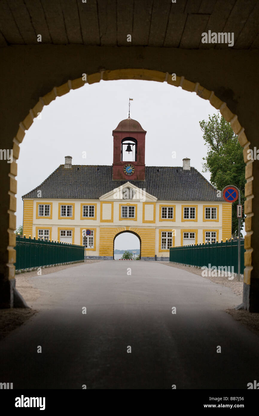 Road Passing Through. The arch of the South gatehouse frames a view of the ornate North gatehouse of this opulent castle. Stock Photo