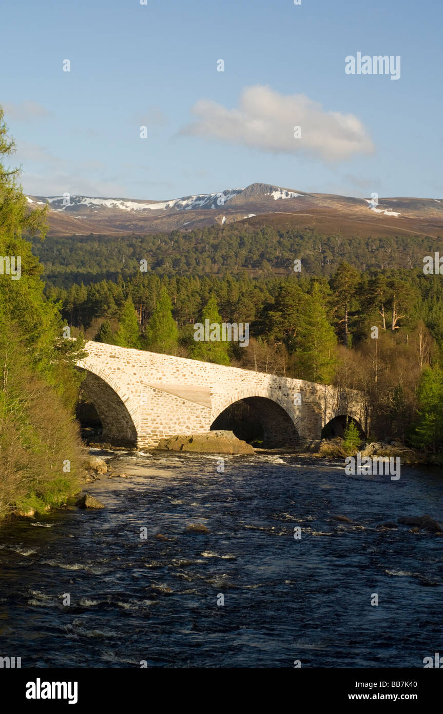 The Old Bridge of Dee at Invercauld, Braemar, looking across Ballochbuie Forest to the hills of the White Mounth. Stock Photo