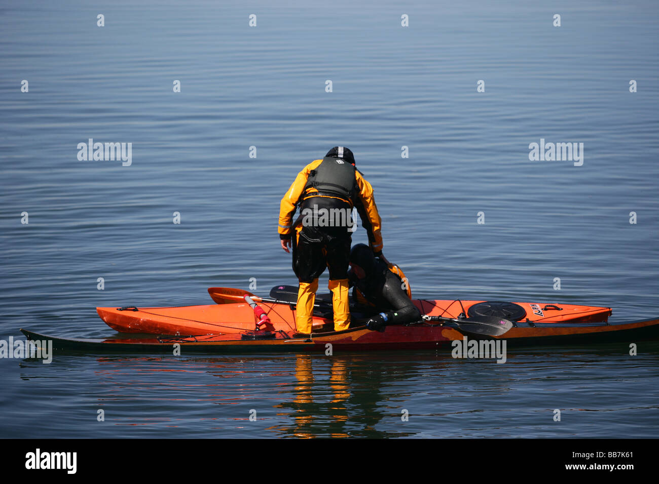 Kayakers perform rescue maneuvers off of Connecticut in Long Island Sound Stock Photo