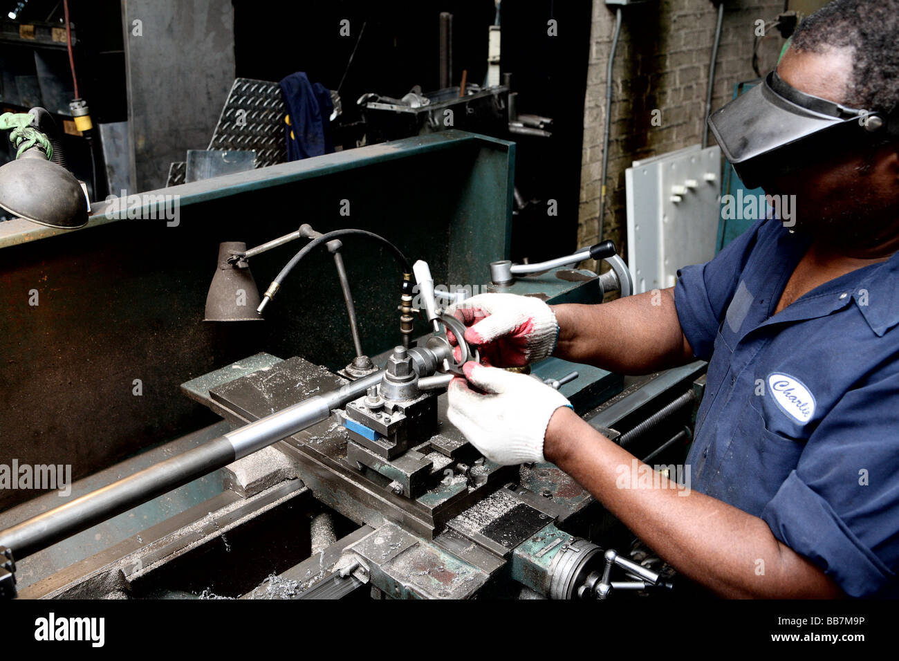 Worker at lathe Stock Photo
