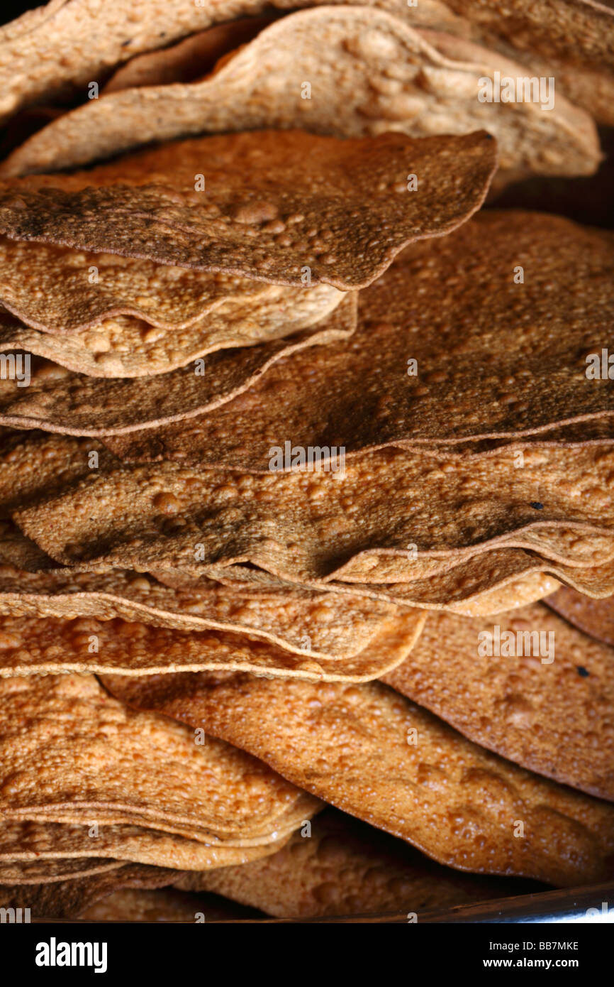 Papad is a thin, crispy Indian preparation sometimes described as a