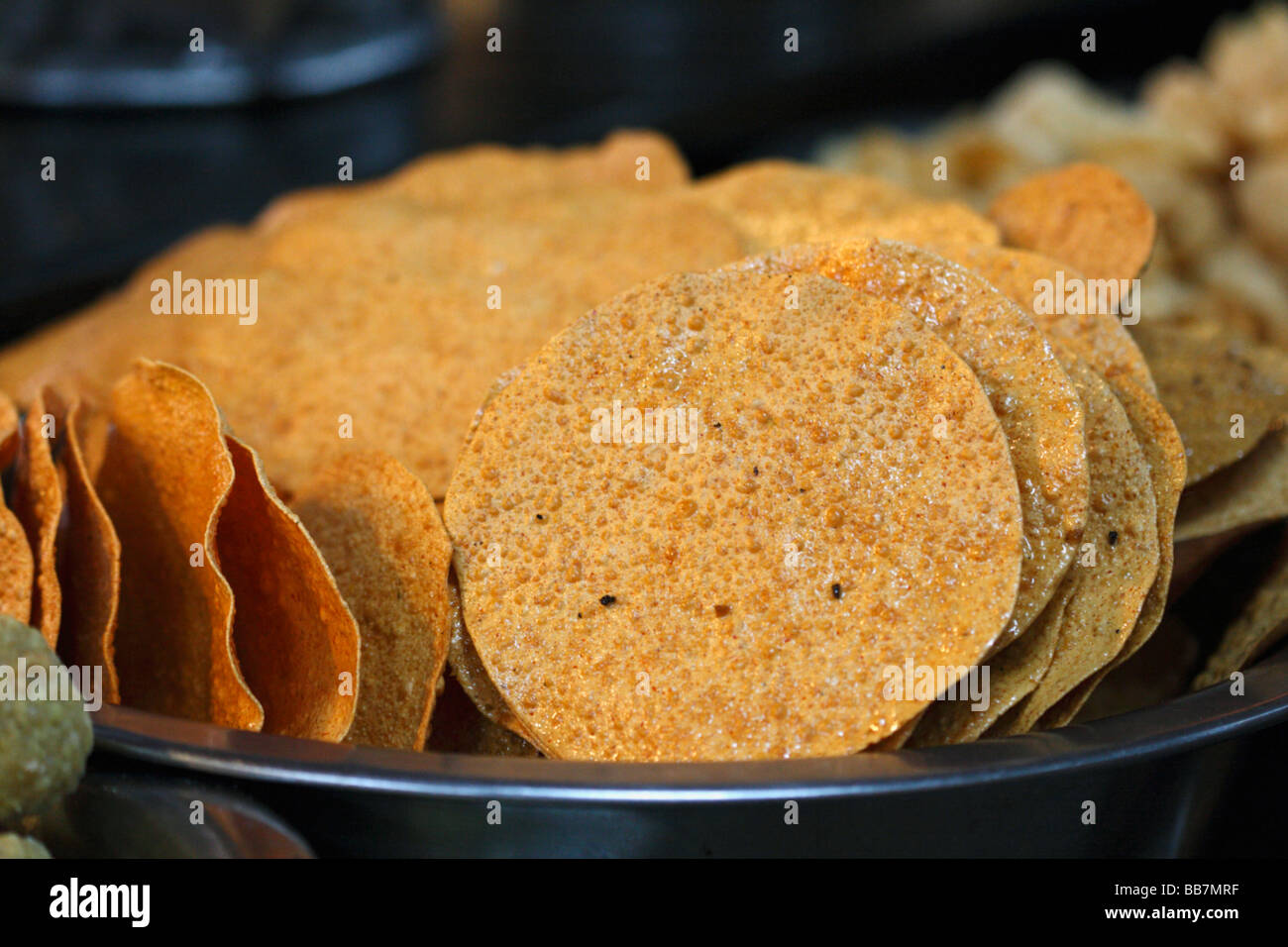 Papad is a thin, crispy Indian preparation sometimes described as a