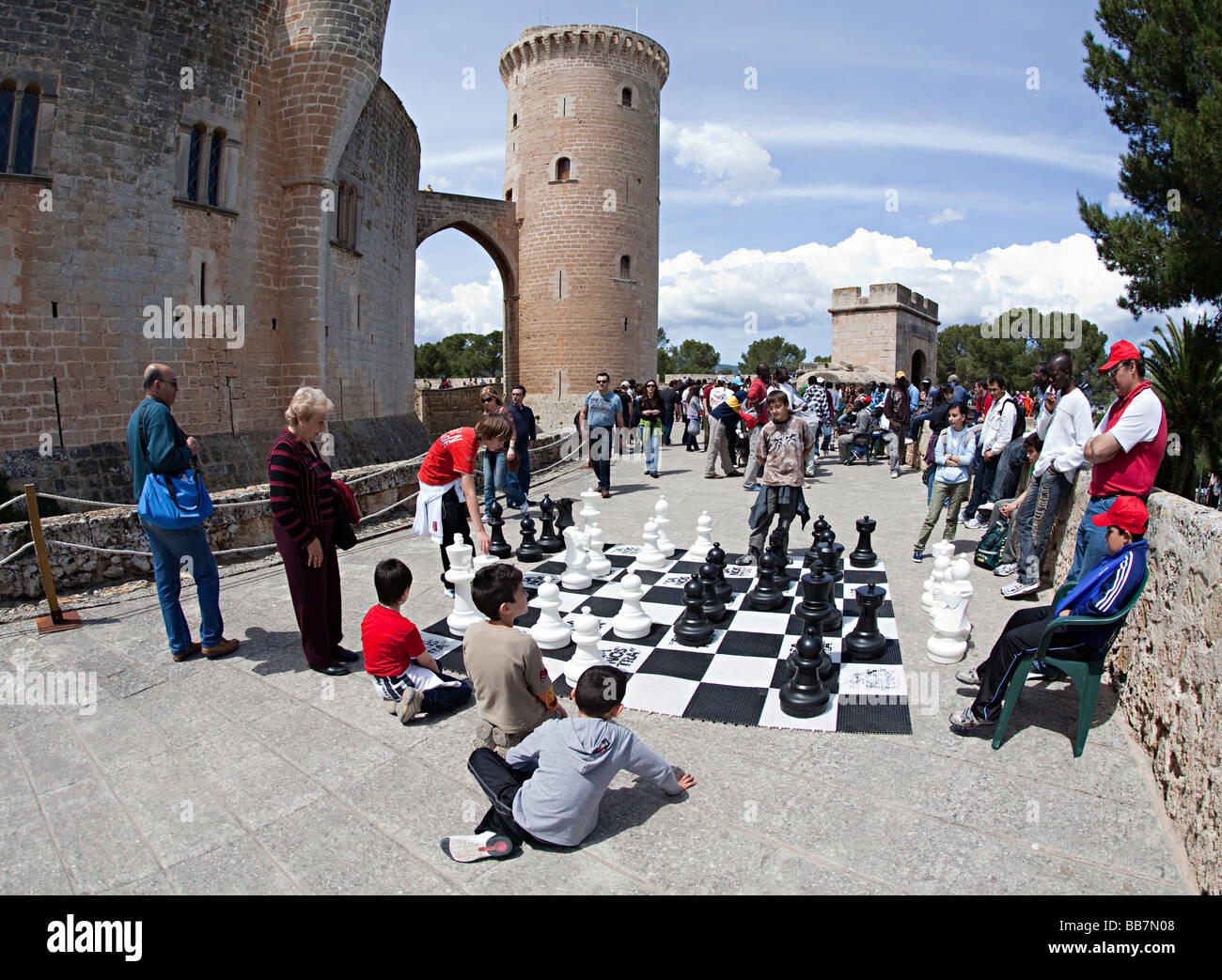 People playing chess in outdoor tournament Bellver Castle Palma