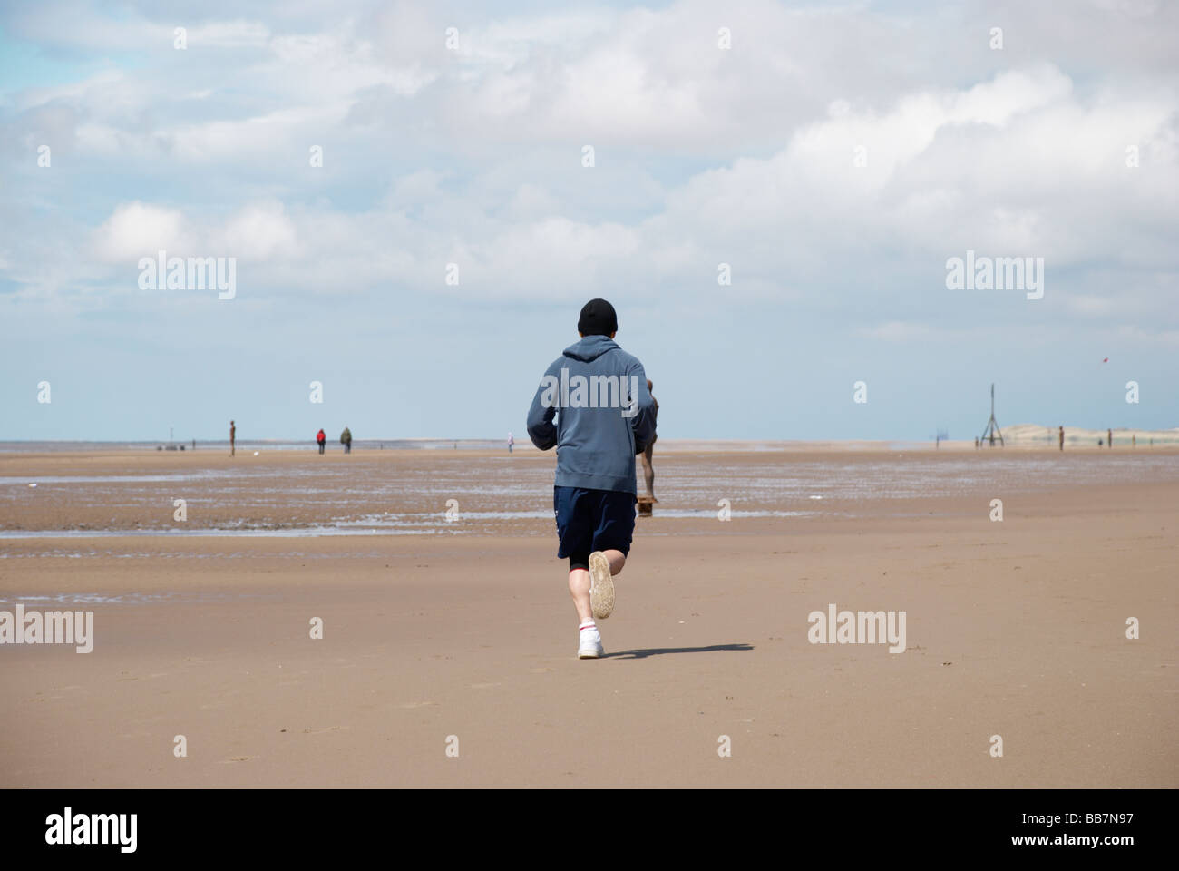 jogger on the beach Stock Photo