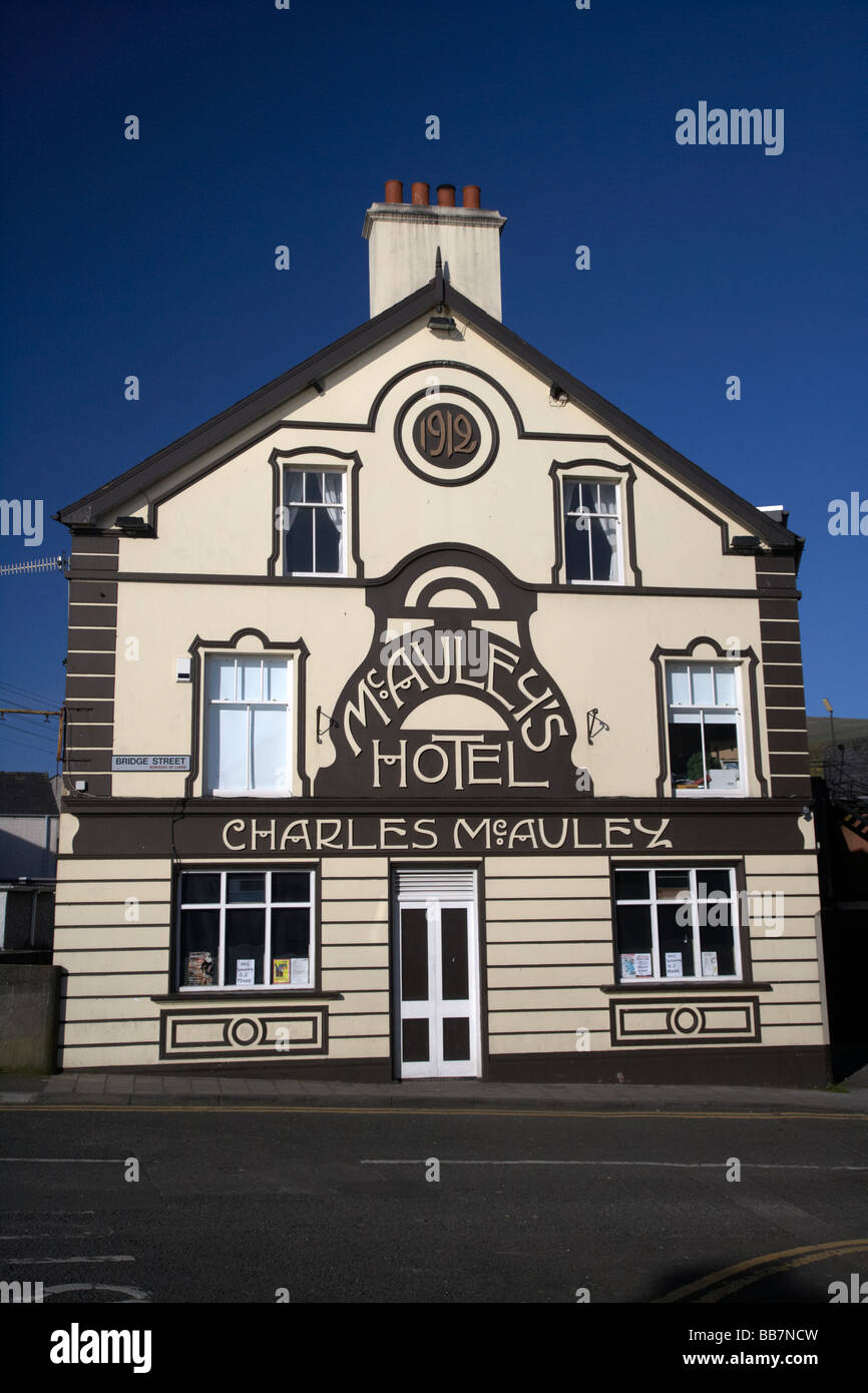 McAuleys hotel and pub also known as the bridge inn in the village of Carnlough county antrim northern ireland uk formerly the rodgers bridge inn bar Stock Photo