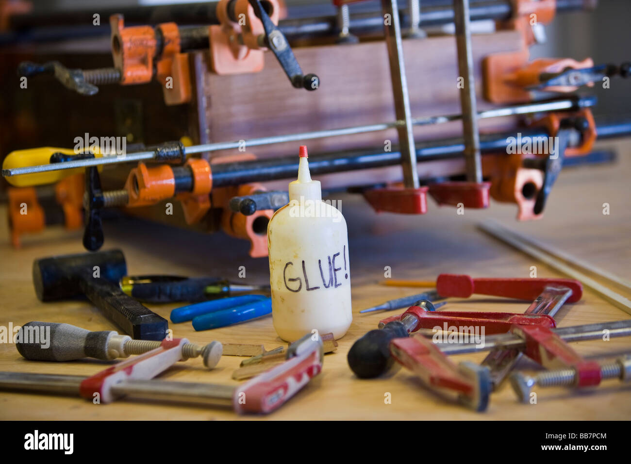 Wood working tools and glue used to repair a broken drawer Stock Photo