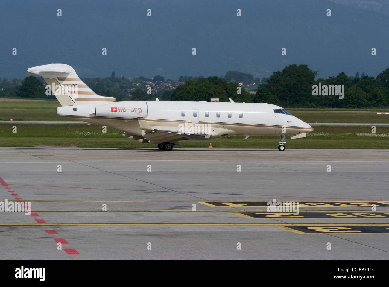 Bombardier BD-100-1A10 Challenger 300 Business Jet HB-JFO Taxiing at Geneva Airport Switzerland Geneve Suisse Stock Photo