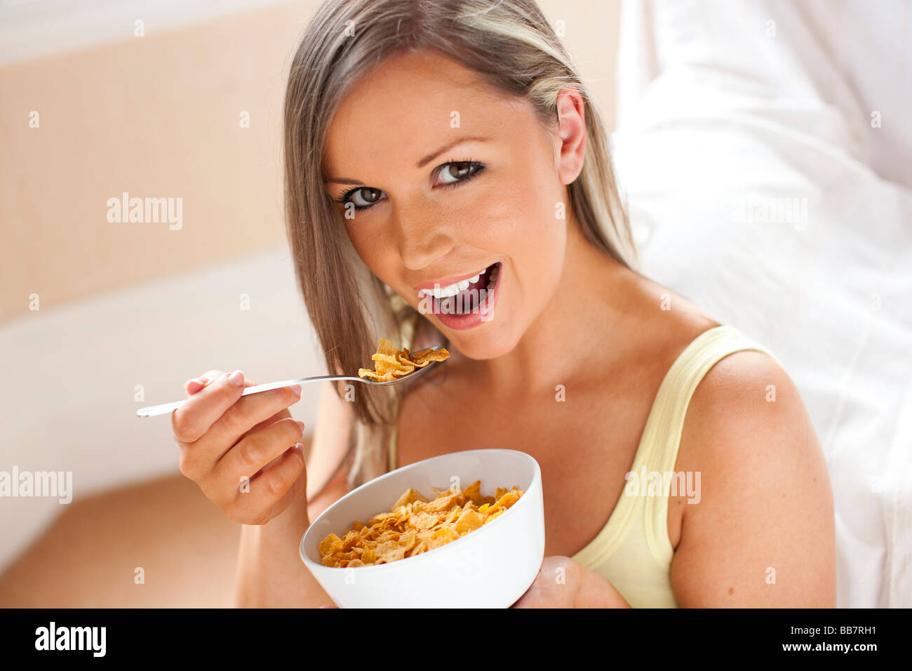 Girl eating Cornflakes breakfast Stock Photo