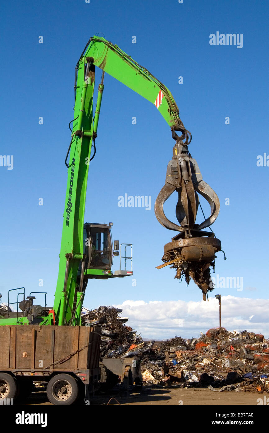 Electromagnetic crane lifting scrap steel for recycling at the Pacific Steel and Recycling center in Elmore County Idaho Stock Photo