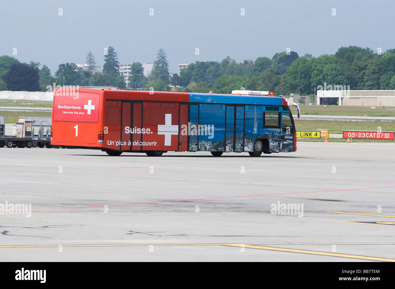 Passenger Bus for Transporting People from Remote Stands to Terminal at Geneva Airport Switzerland Geneve Suisse Stock Photo
