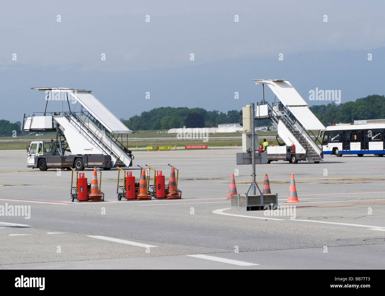 Mobile Aircraft Stairways and Passenger Bus near Remote Stands at Geneva Airport Switzerland Geneve Suisse Stock Photo