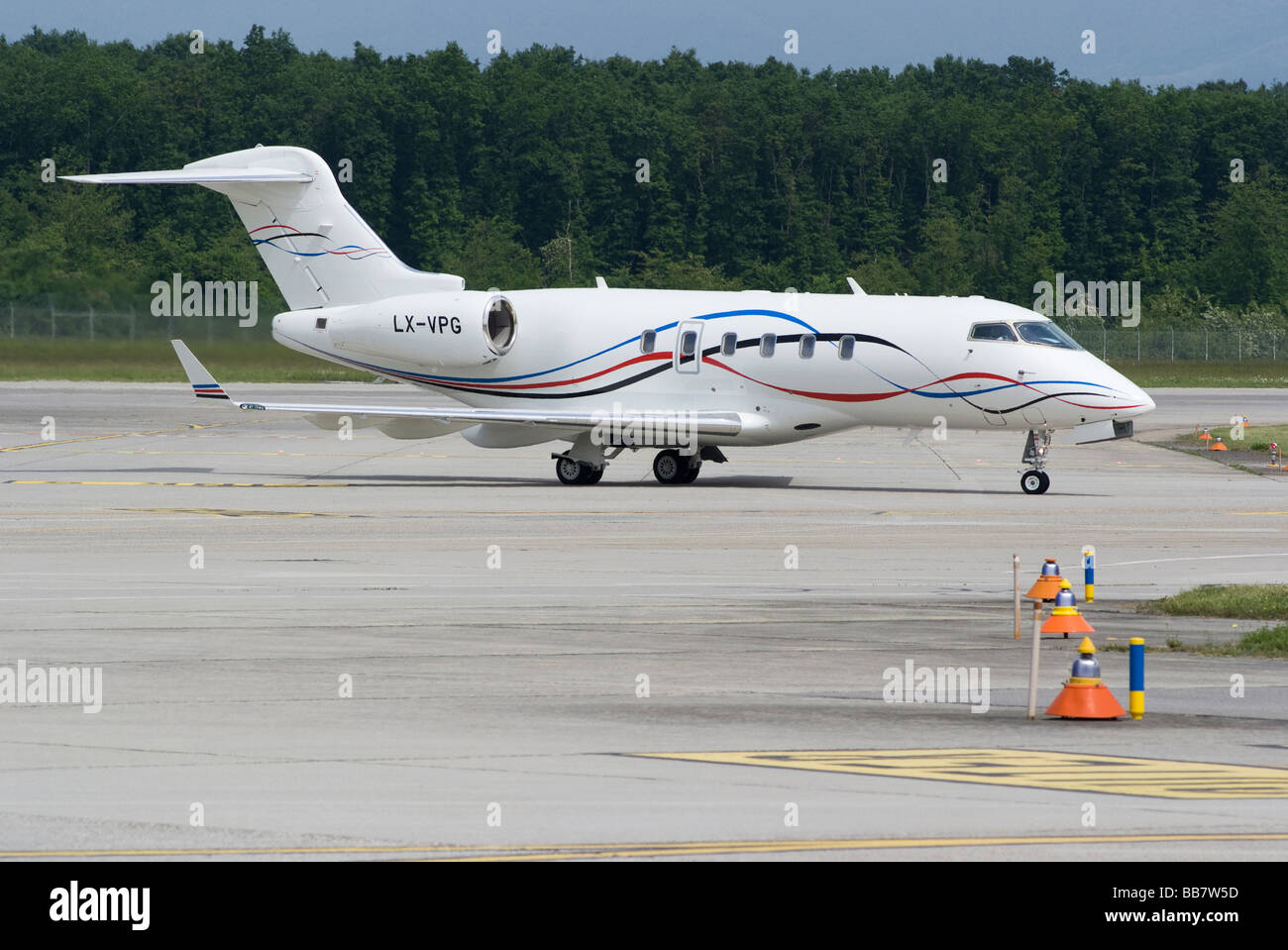 Bombardier BD-100-1A10 Challenger 300 Business Jet LX-VPG Taxiing at Geneva Airport Switzerland Geneve Suisse Stock Photo