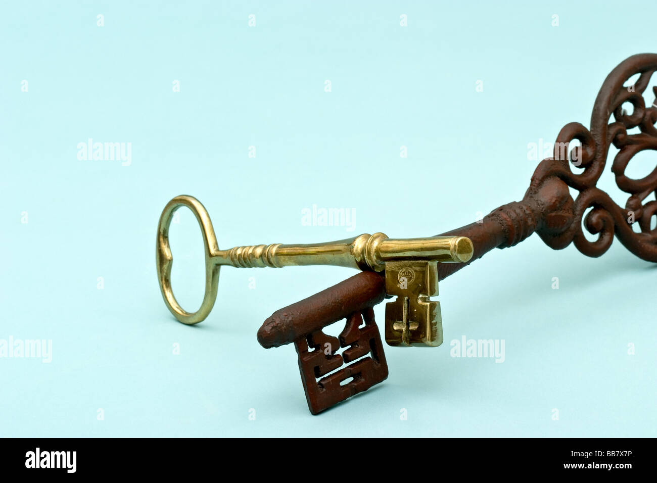 Two metal old fashioned keys, one atop the other Stock Photo Alamy