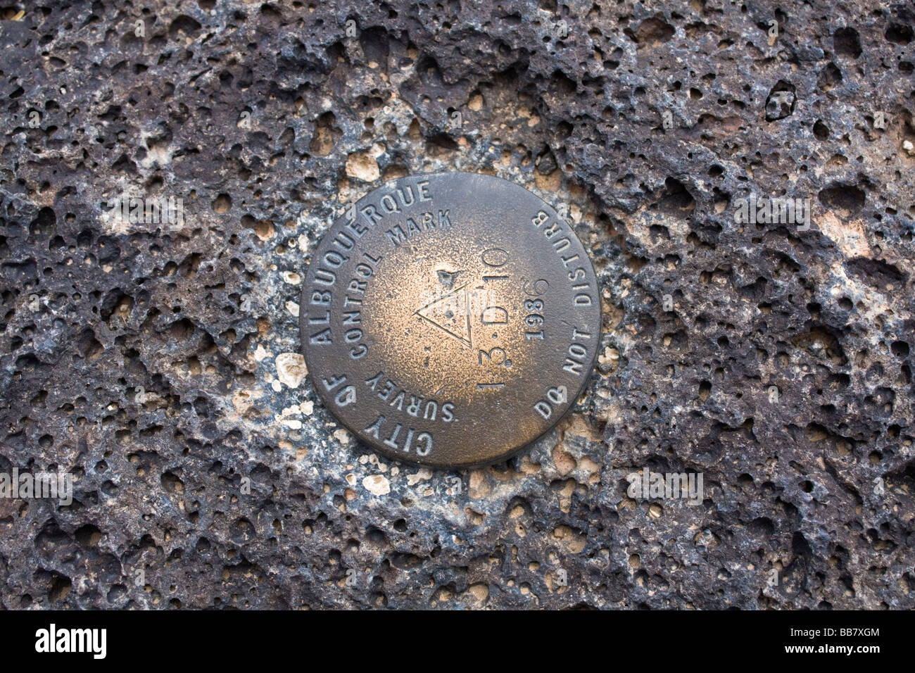 Benchmark found in volcanic rock Albuquerque New Mexico Stock Photo