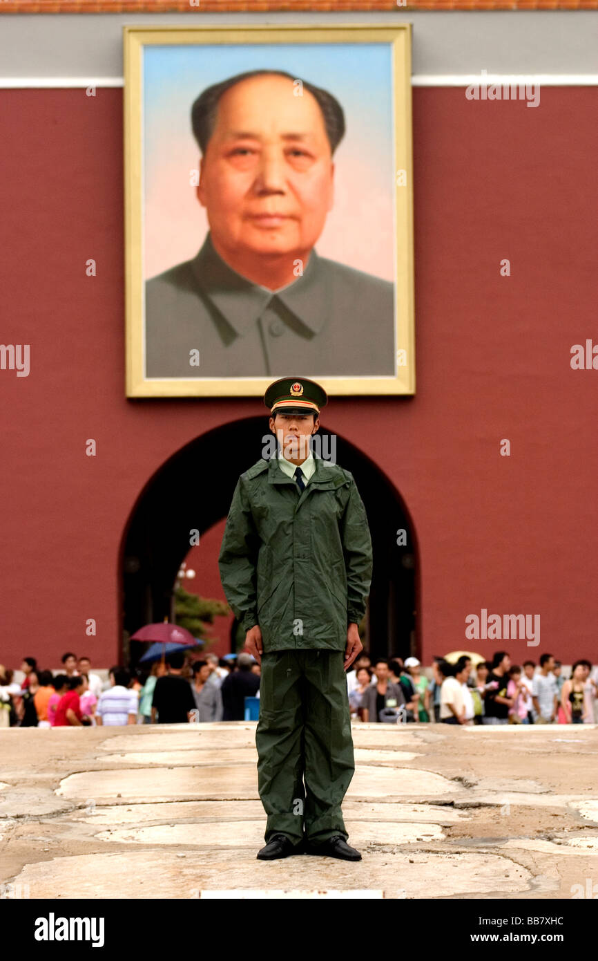 A guard stands in front of The Gate of Heavenly Peace and Mao Zedong portrait in Beijing, People's Republic of China. Stock Photo