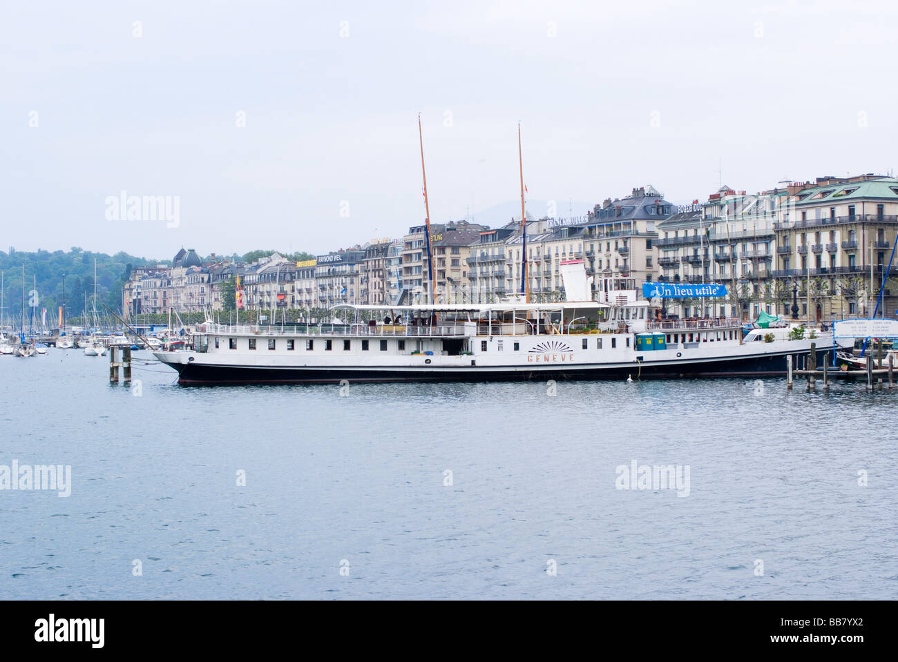 Tourist Boat Geneve on Lake Geneva Geneva City Switzerland with Buildings in Background Stock Photo
