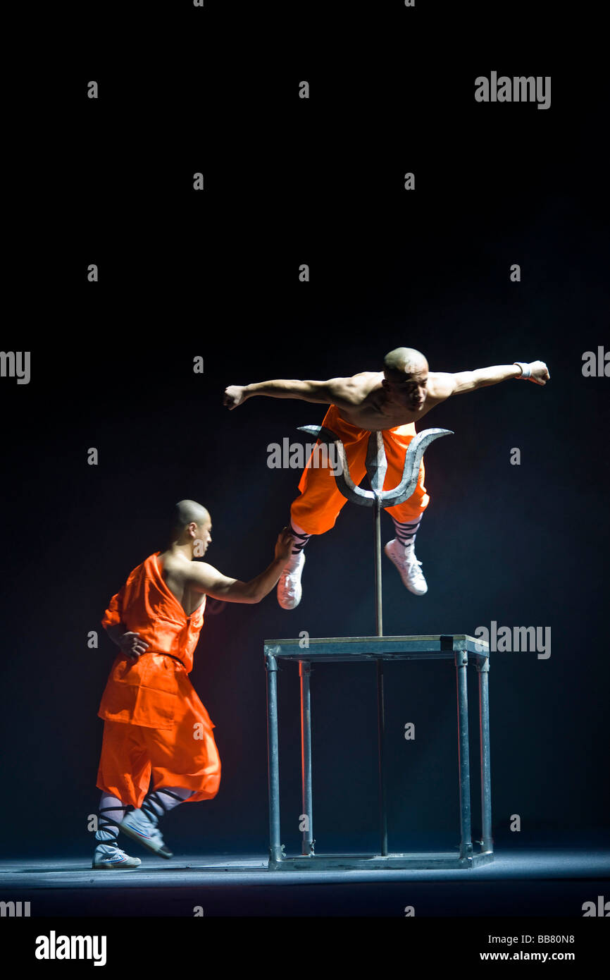 The will of the monk is so powerful that he is not hurt by the iron lance, Shaolin monks during a show on the 22nd of March 200 Stock Photo