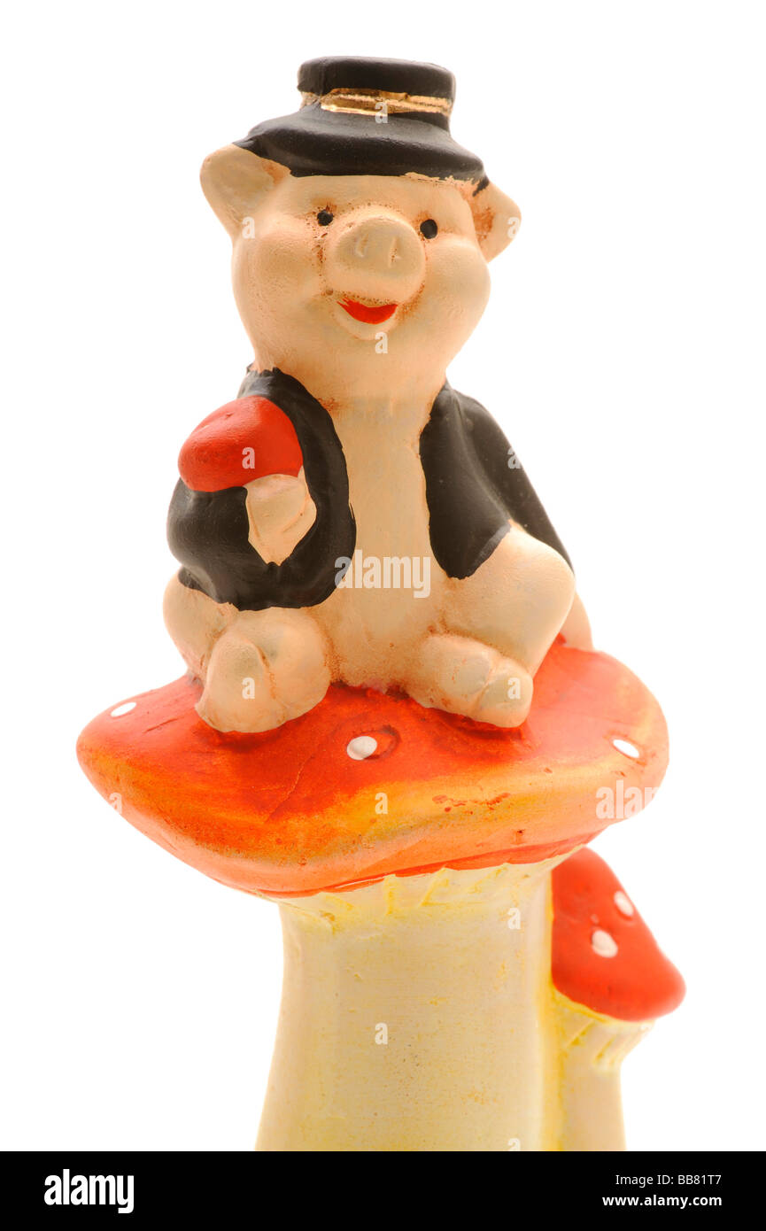 Marzipan pig sitting on a Fly Agaric Stock Photo