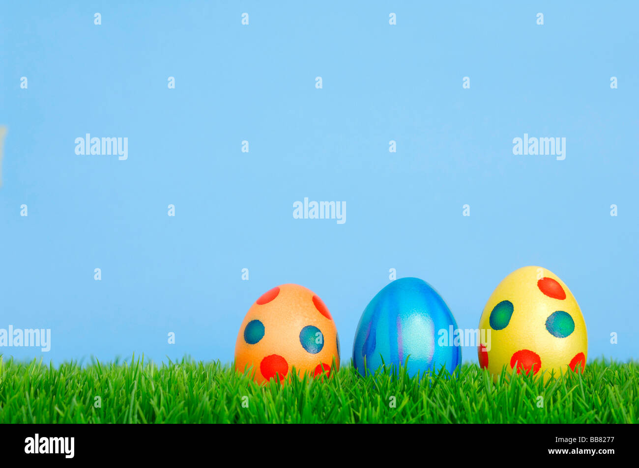 Colourful Easter eggs on grass Stock Photo