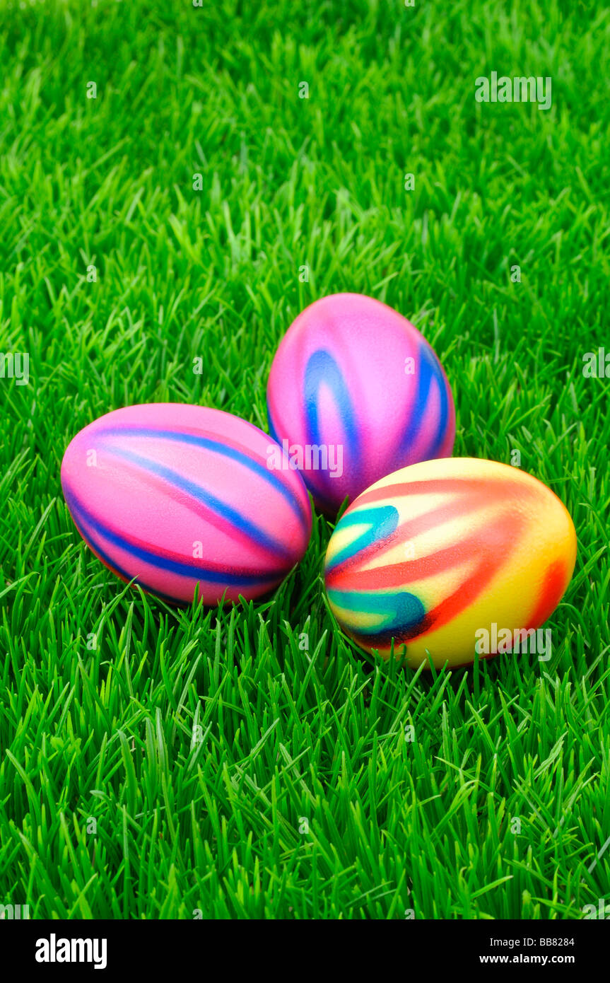 Colourful Easter eggs on grass Stock Photo