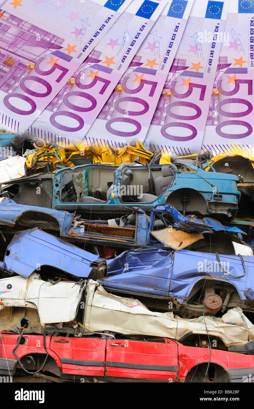 Junk cars, bank notes, symbolic picture for scrapping premium Stock Photo