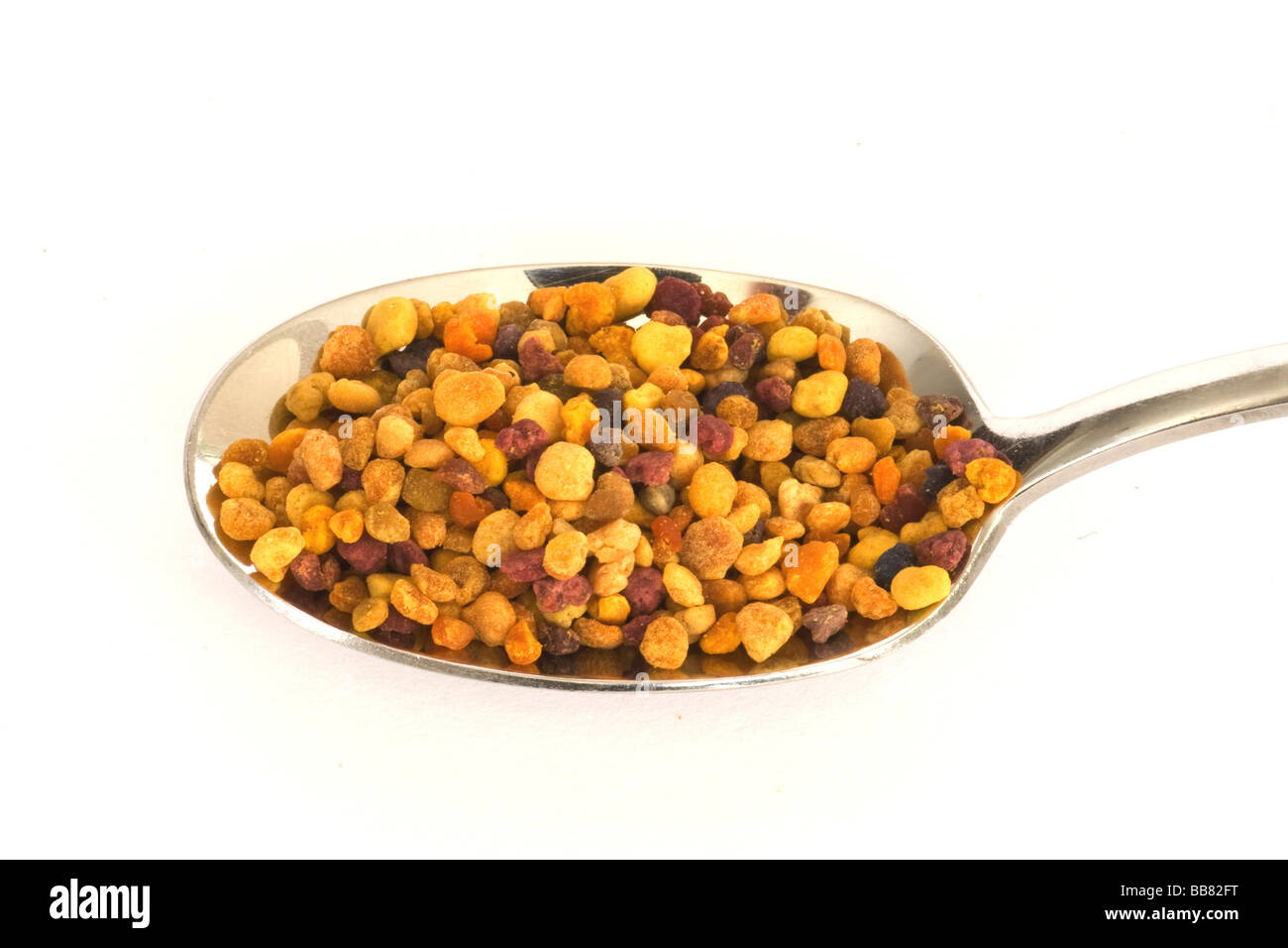 Blossom pollen from a beekeeper on a spoon Stock Photo