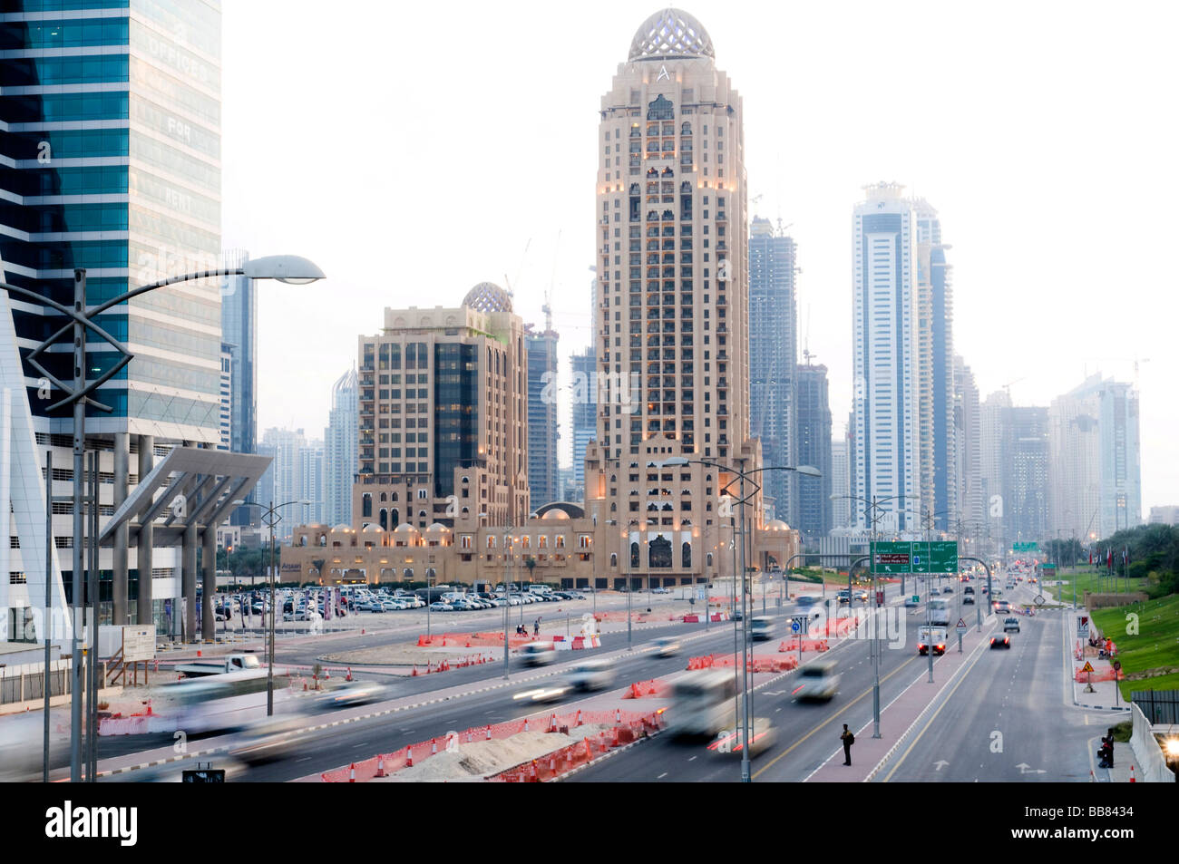 Skyscrapers and street with cars, motion blur, Dubai, United Arab
