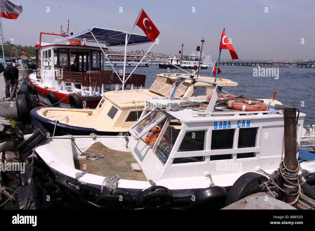Istanbul Turkey small local water taxi boats moored at the Halic ferry terminal at Eminonu on the Golden Horn Stock Photo