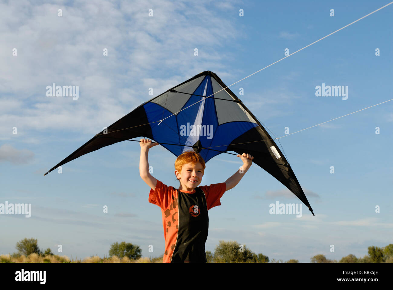 Boy flying kite, kite flying, kiting Stock Photo Alamy